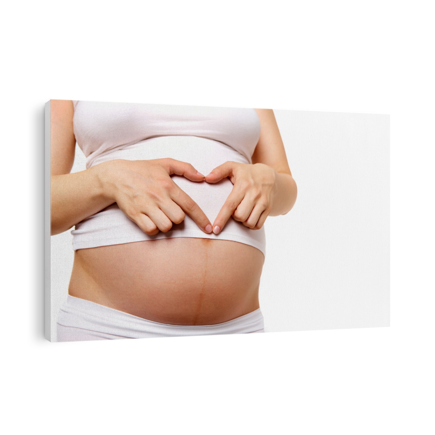 Image of pregnant woman belly with heart made up of fingers
