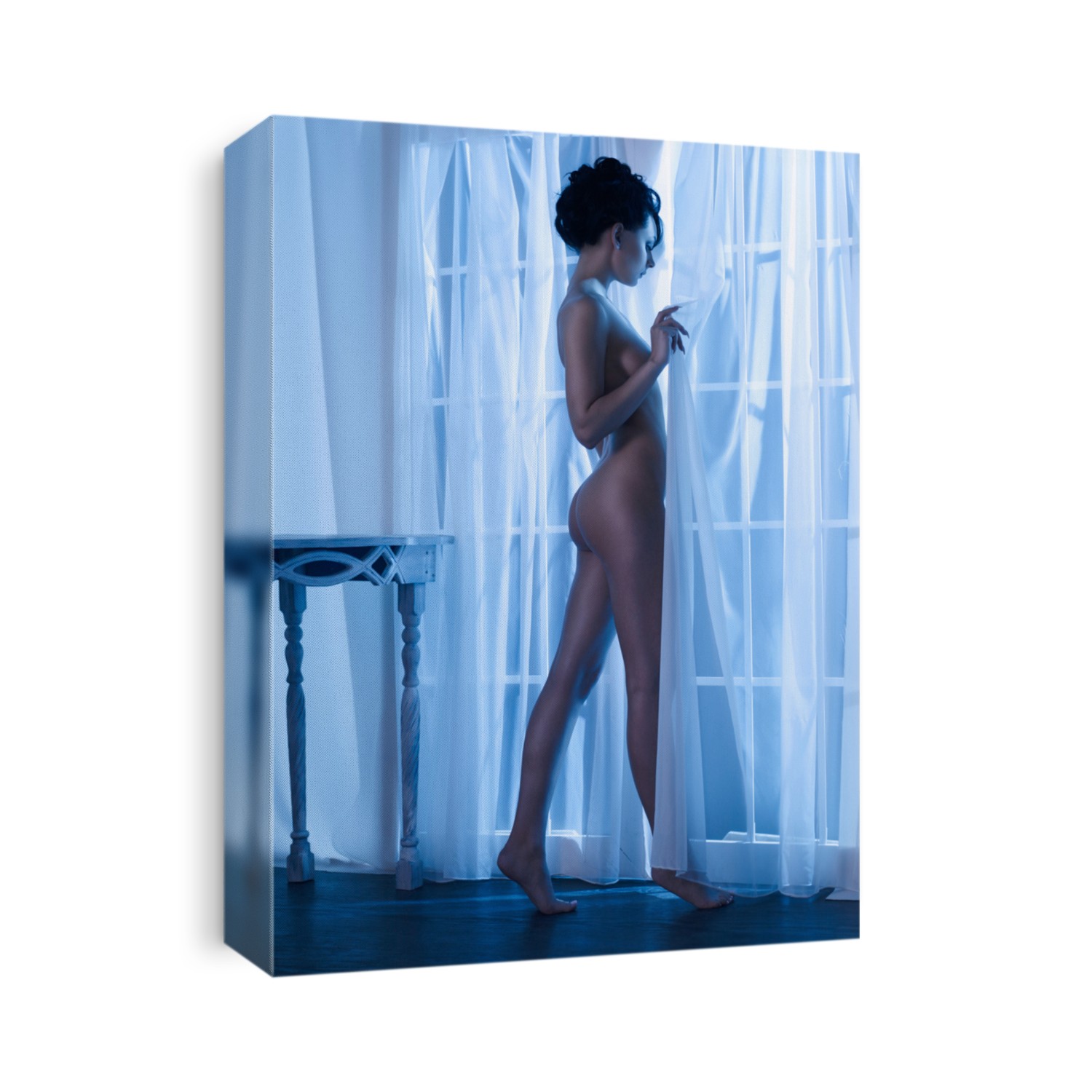 Art boudoir fashion photo of nude elegant woman at the window in the moonlight. Perfect body. Beauty and health